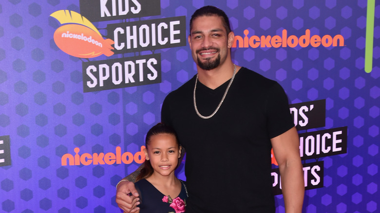 Roman Reigns with his daughter at the Kid's Choice Awards