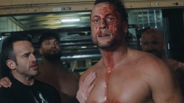 A bloody Matt Taven with the Undisputed Kingdom