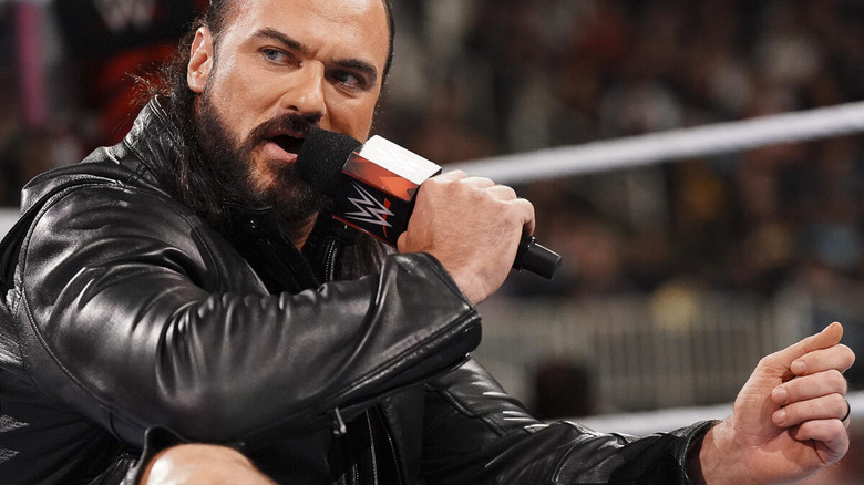 Drew McIntyre sits and speaks into microphone