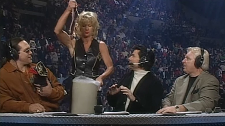 Medusa dropping the WWF Women's Championship in the trash