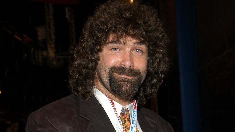 Mick Foley smiling suit