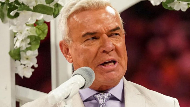 Eric Bischoff speaking into microphone