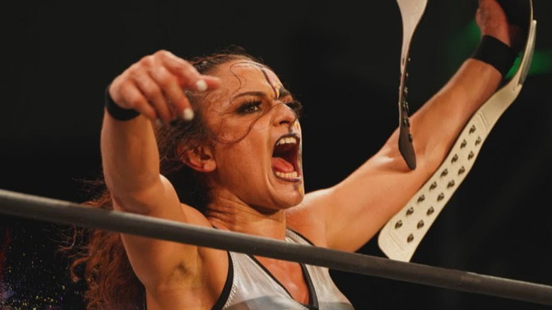 Thunder Rosa celebrates with the title