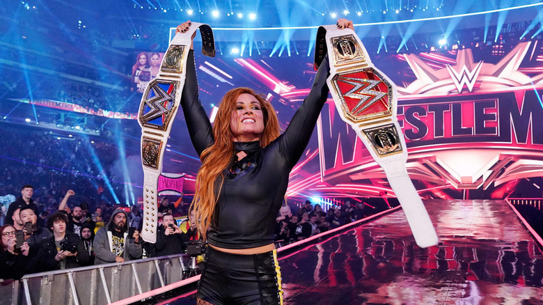 Becky Lynch holding the Raw and SmackDown Women's Championships