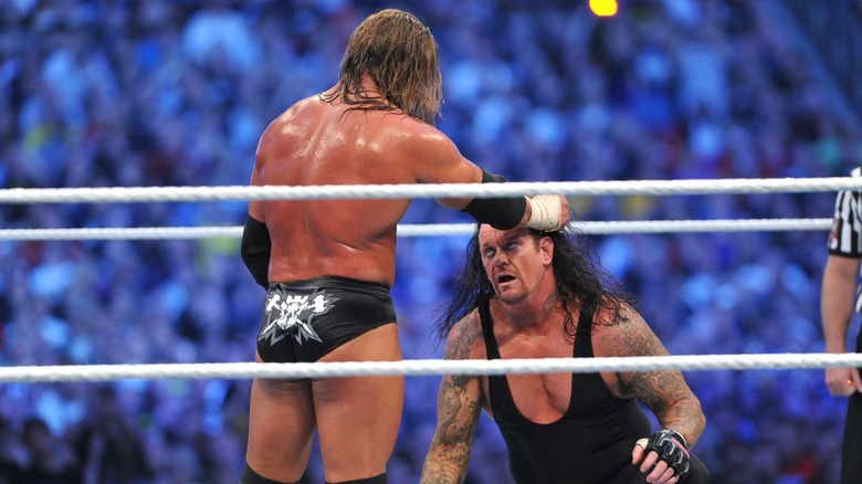 Triple H grabs The Undertaker