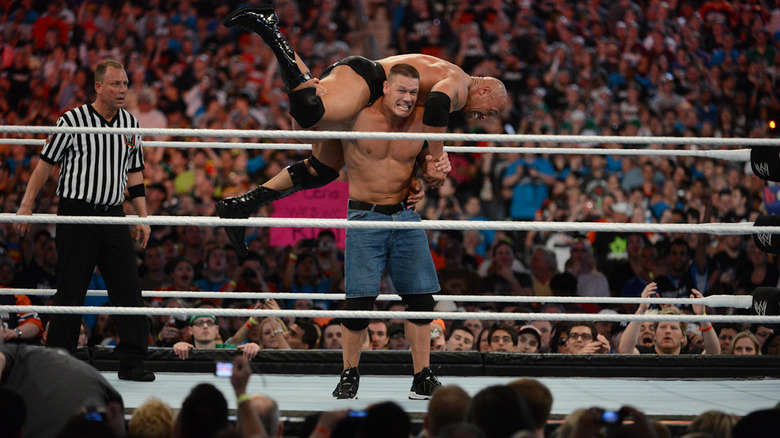 John Cena carries The Rock