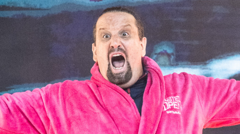 TNA booker Tommy Dreamer in a pink Busted Open bathrobe