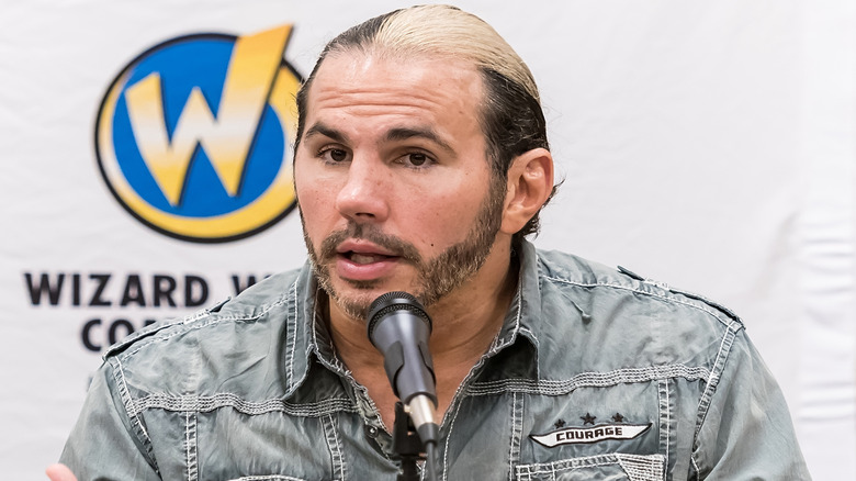 Matt Hardy responds to an audience member's question during a panel event