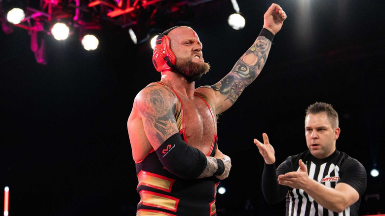 Josh Alexander stands victorious in a TNA ring