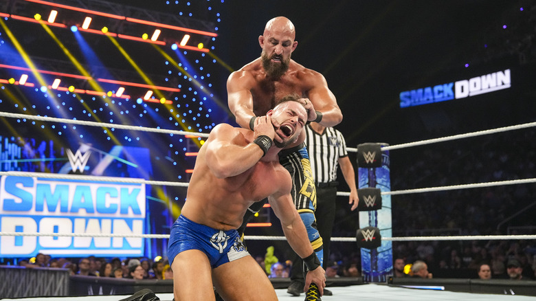 Tommaso Ciampa works a hold on Austin Theory