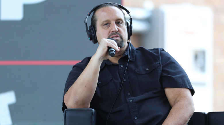 Tommy Dreamer speaking into a microphone