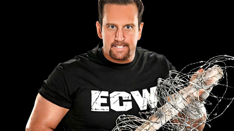 Tommy Dreamer holding barbed wire