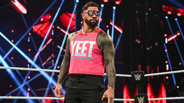 Jey Uso awaits his turn to say something in the ring during a 