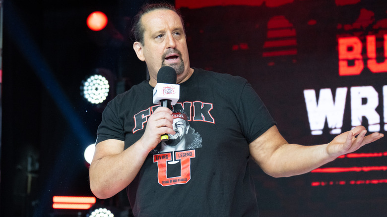 Tommy Dreamer talking into microphone