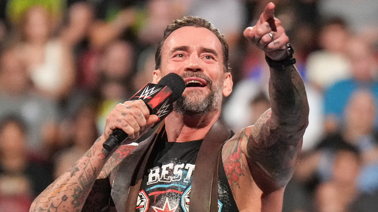 Cm punk pointing at crowd