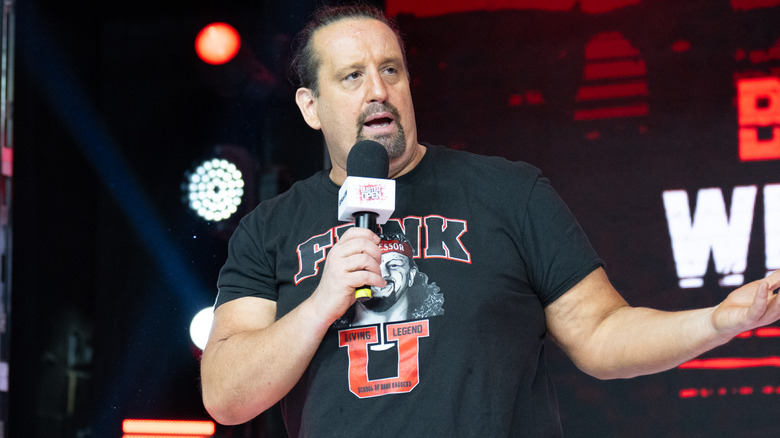 Tommy Dreamer talking into microphone