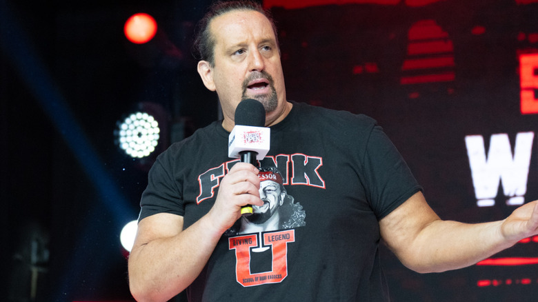 Tommy Dreamer talking into a microphone