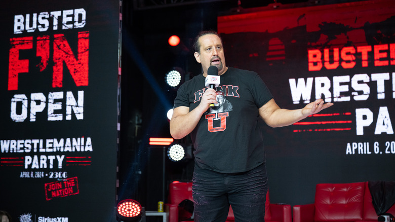 Tommy Dreamer at an event with a microphone