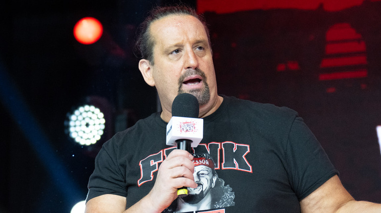 Tommy Dreamer talking into a microphone