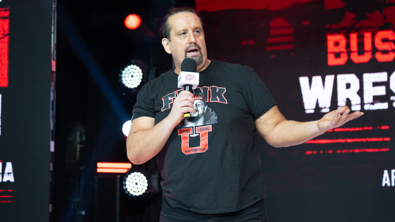 Tommy Dreamer speaking and shrugging