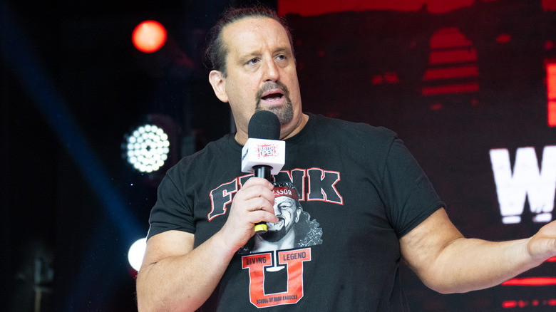 Tommy Dreamer talking into microphone