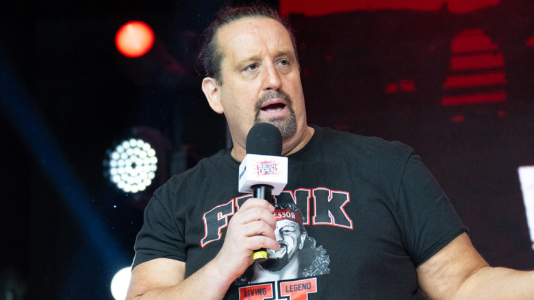 Tommy Dreamer talking into a microphone