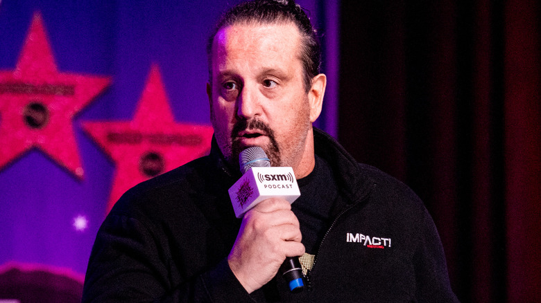 Tommy Dreamer talking into microphone