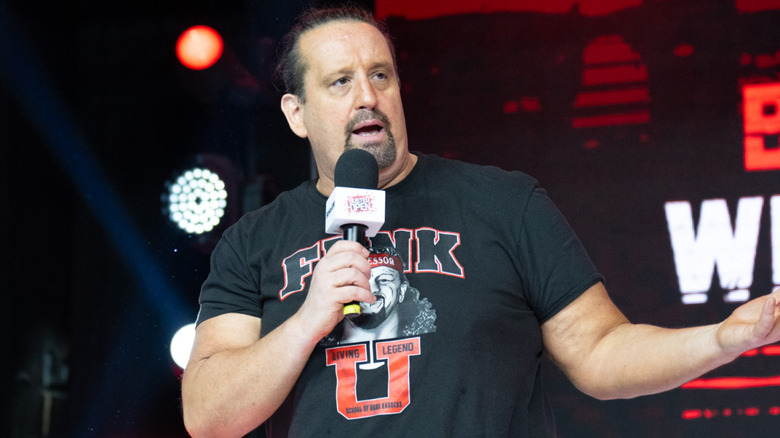 Tommy Dreamer talking into microphone