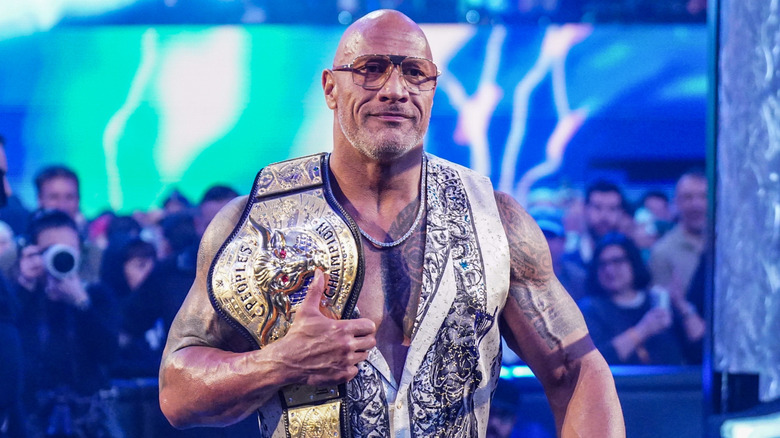 Dwayne "The Rock" Johnson holding his People's Championship