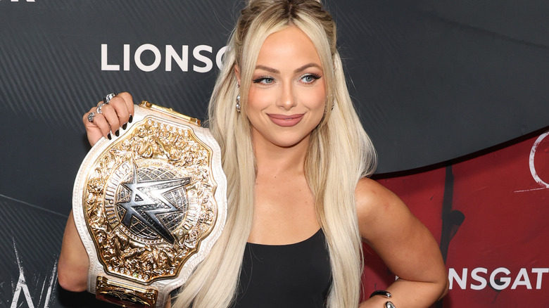 Liv Morgan holding the WWE Women's World Championship