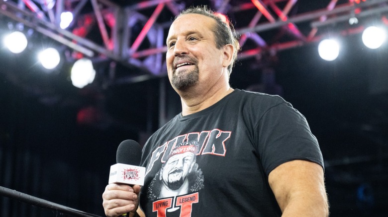 Tommy Dreamer smiling and holding a mic