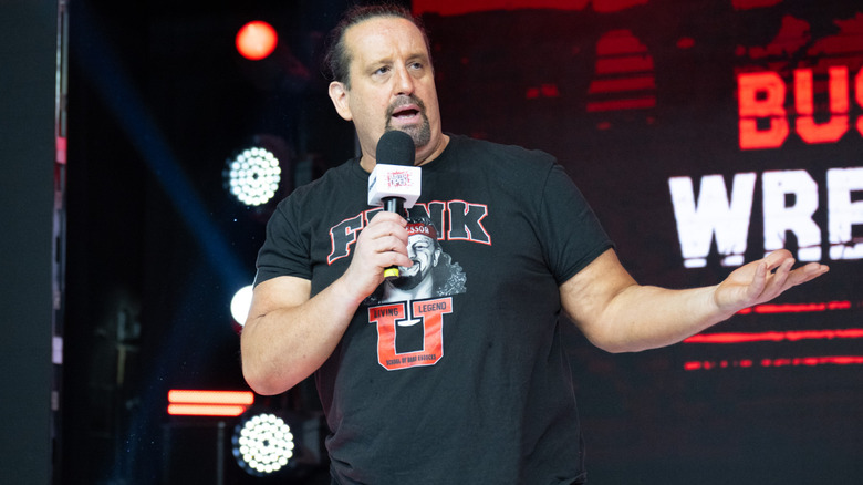 Tommy Dreamer talking into microphone