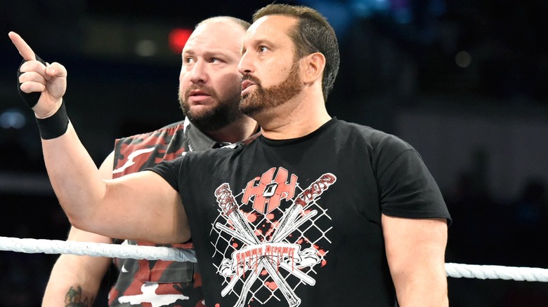 Tommy Dreamer pointing with Bully Ray standing behind him