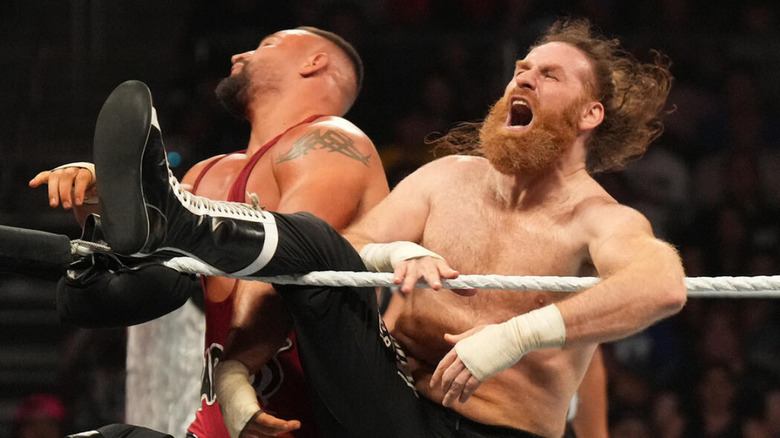 Sami Zayn kicking Bron Breakker in the face