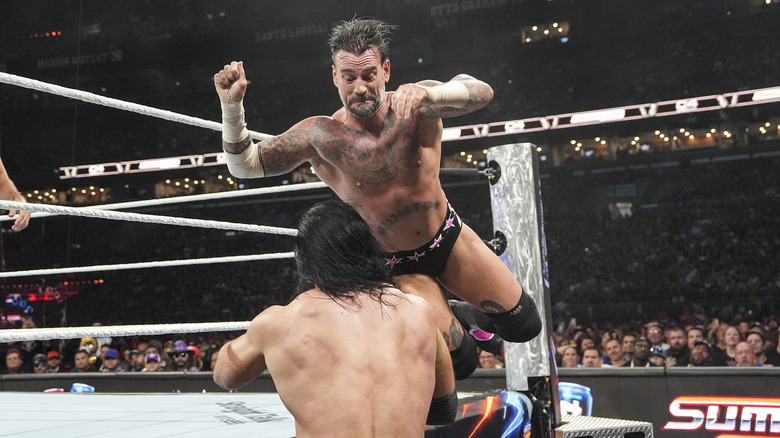 CM Punk dives onto Drew McIntyre