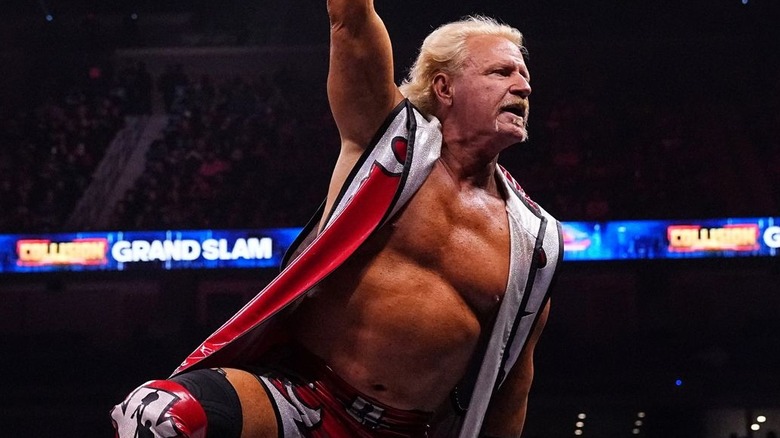 Jeff Jarrett wears a seat of red, silver, and black gear.