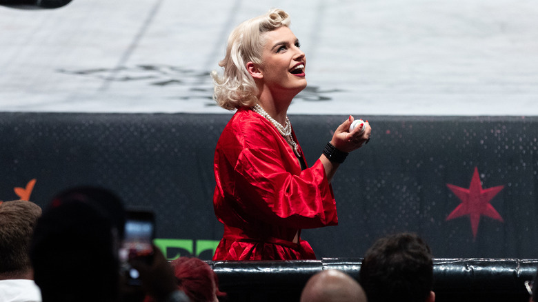 Toni Storm looks gleefully above