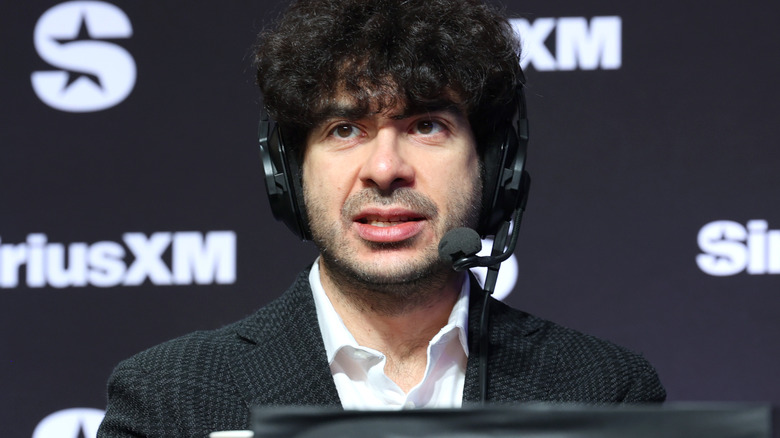 Tony Khan wearing a headset