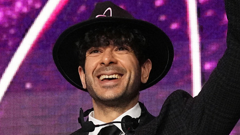 Tony Khan smiling in a hat