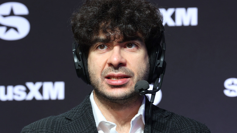 tony khan wearing a headset