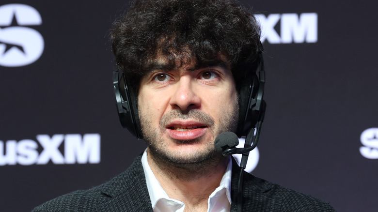 Tony Khan wearing a headset