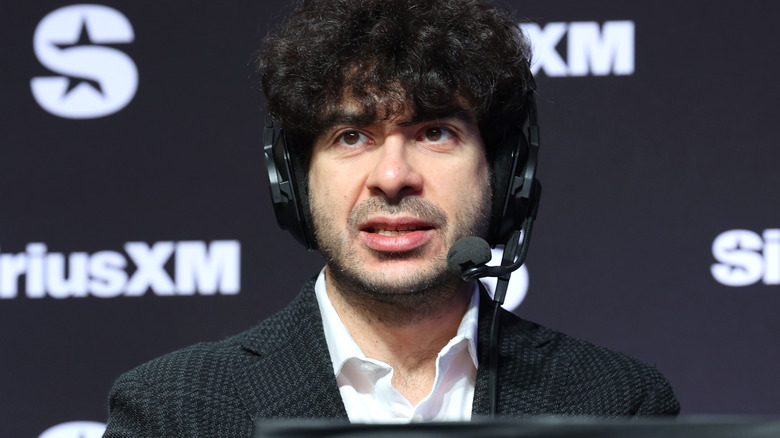 Tony Khan wearing a headset