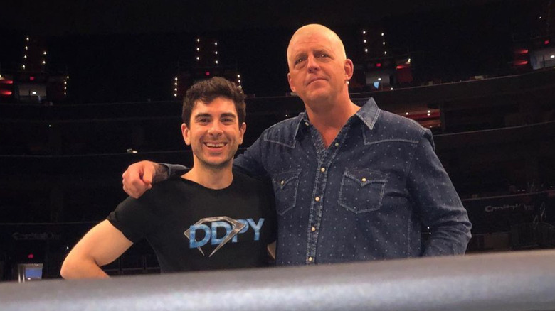 Tony Khan and Dustin Rhodes in the ring