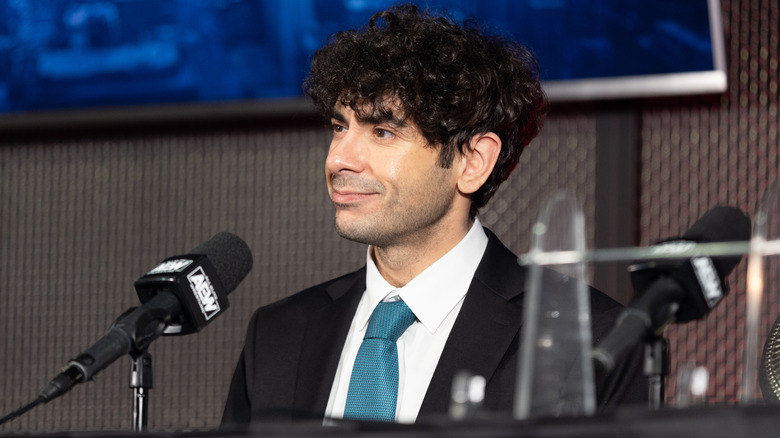 Tony Khan sits at an AEW media scrum