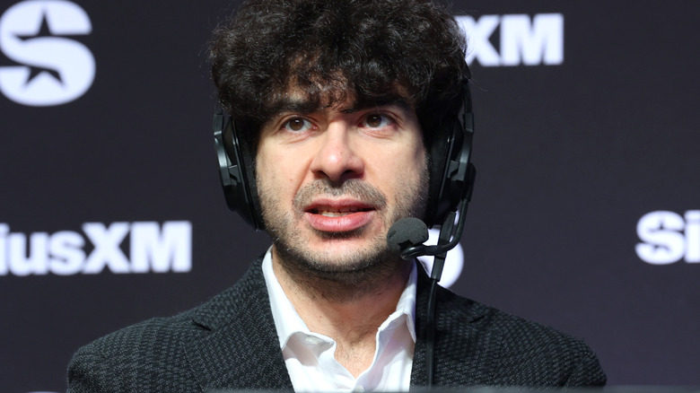 Tony Khan wearing a headset