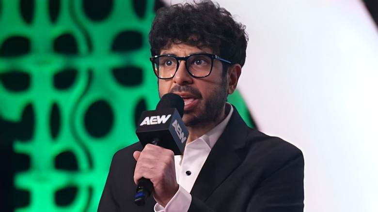 Tony Khan holding a mic at AEW WrestleDream