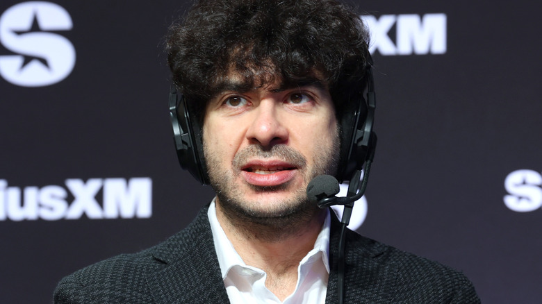 Tony Khan wearing a headset