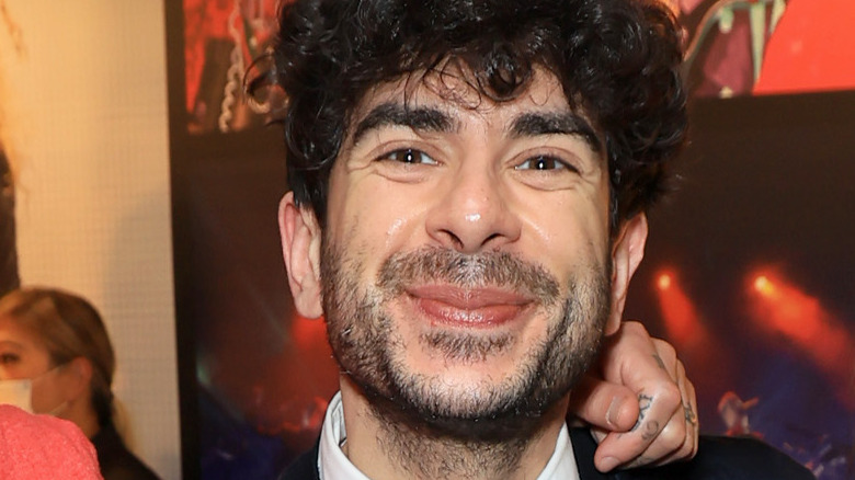 AEW CEO Tony Khan grinning