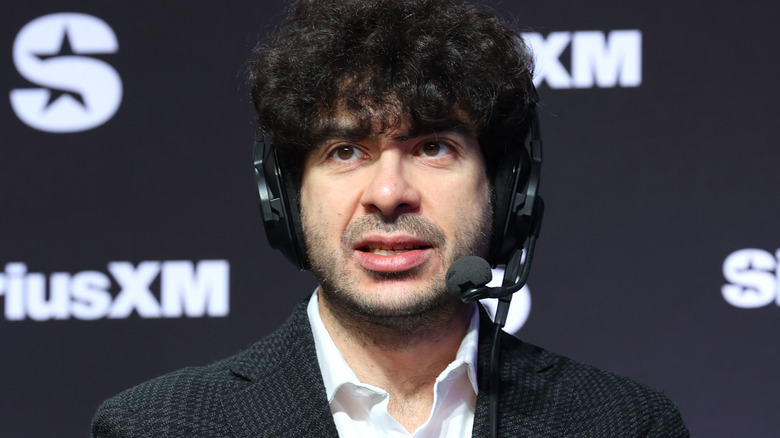 Tony Khan wearing a headset