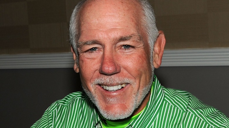 Tully Blanchard in a green striped shirt 